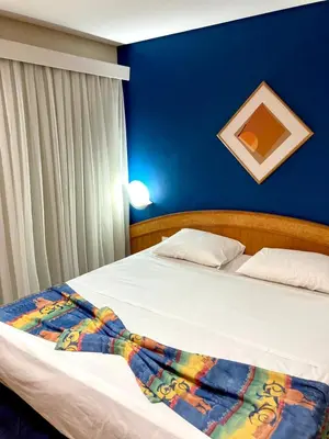 Uma cama ou camas num quarto em Hotel Flat Classic