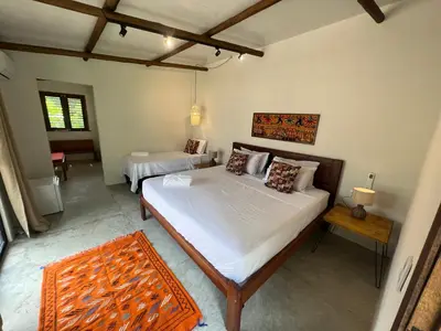 Uma cama ou camas num quarto em Villa Albergaria Icaraizinho