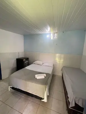 Uma cama ou camas num quarto em Pousada Bê Kite Cauipe