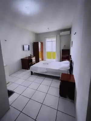 Uma cama ou camas num quarto em Hotel e Flat Sobral Mundi