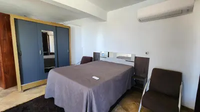 Uma cama ou camas num quarto em Chácara Atlântica
