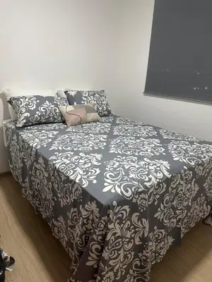 Uma cama ou camas num quarto em Apartamento Frente a Praia
