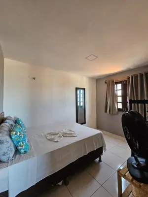 Uma cama ou camas num quarto em Casa sol nascente