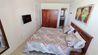 Uma cama ou camas num quarto em Nosso cantinho no paraíso