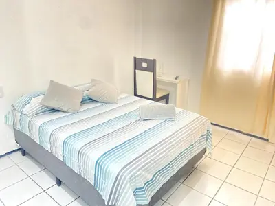 Uma cama ou camas num quarto em Casa na Lago Jacarey Gastronomia
