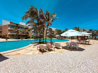A piscina em ou perto de Porto das Dunas Apê na Areia com Banheira, lazer total e estrutura de praia para toda a Família