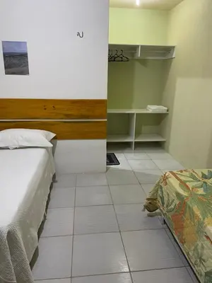 Uma cama ou camas num quarto em Flecheiras- Davitória