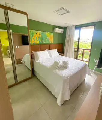 Uma cama ou camas num quarto em Wai Wai Cumbuco Ocean View Pé na Areia
