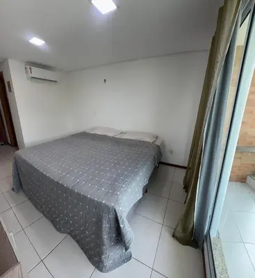 Uma cama ou camas num quarto em Apartamento Catú lake