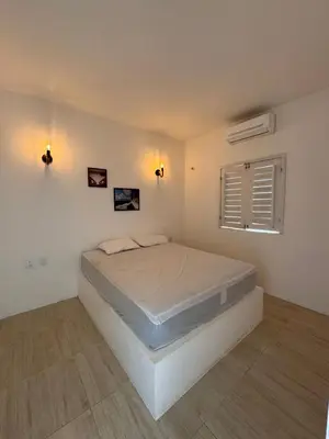 Uma cama ou camas num quarto em Villa Kite House