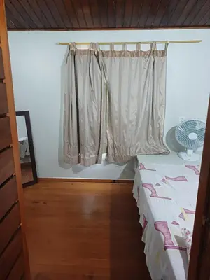 Uma cama ou camas num quarto em Chalé Icaraí