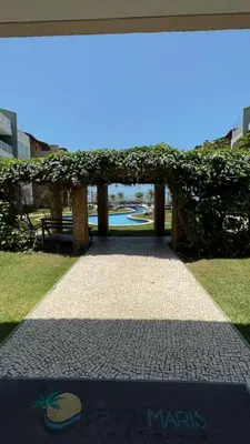 Um jardim no exterior de Apt TERRAMARIS - DE FRENTE PARA O MAR