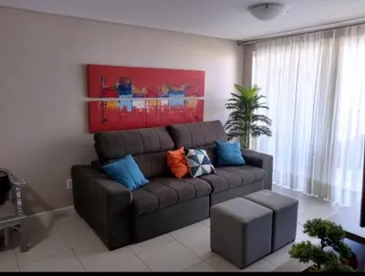 Uma área de estar em Apt TERRAMARIS - DE FRENTE PARA O MAR
