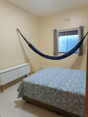Uma cama ou camas num quarto em Nova casa de praia na Caponga