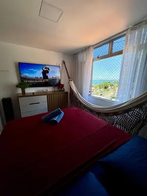 Uma cama ou camas num quarto em Flat alto padrão moderno frente a praia melhor localização na beira mar