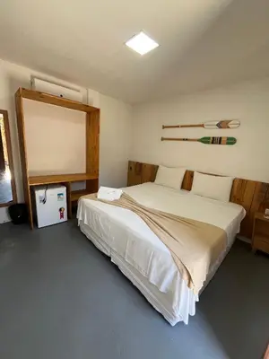 Uma cama ou camas num quarto em Pousada Altas Horas Icaraizinho