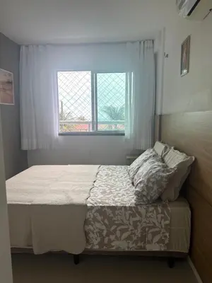 Uma cama ou camas num quarto em Mar e Sol Porto das Dunas