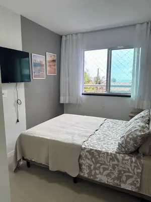 Uma cama ou camas num quarto em Mar e Sol Porto das Dunas