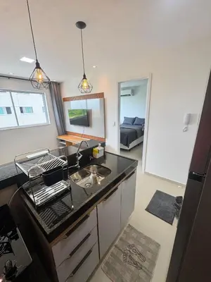 A cozinha ou kitchenette de AP completo próx ao Shopping com piscina, garagem e ar