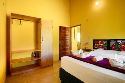 Uma cama ou camas num quarto em Casa Amarela em Icaraí de Amontada | by Aquarela