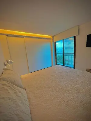 Uma cama ou camas num quarto em Bangalô Duplex Exclusivo em Manhattan Riviera
