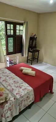 Uma cama ou camas num quarto em Recanto da Felicidade