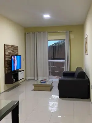 Uma televisão e/ou sistema de entretenimento em Apartamento Kite Village Deluxe Cumbuco