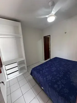 Uma cama ou camas num quarto em Apartamento no Centro