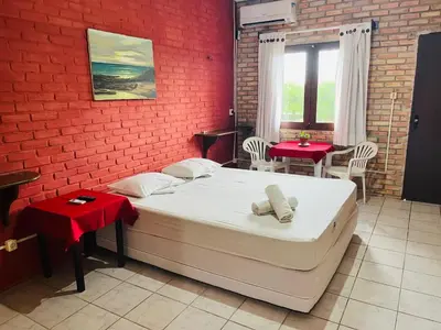 Uma cama ou camas num quarto em Hotel das Falésias Praia das Fontes