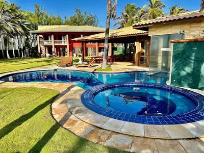A piscina em ou perto de Casa pé na areia, com 5 quartos