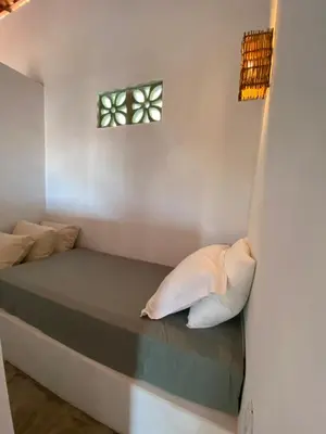Uma cama ou camas num quarto em Chalé Vila Mathilde