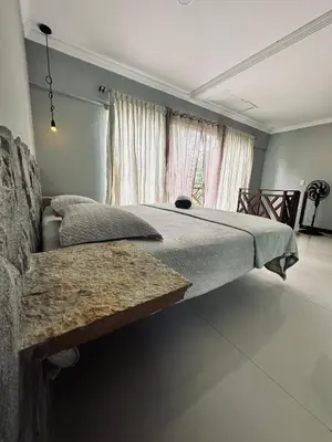 Uma cama ou camas num quarto em Villa Suíça Guaramiranga