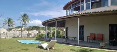 Um jardim no exterior de Casa de Praia em Aracati - 