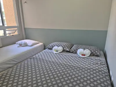Uma cama ou camas num quarto em TerraMaris - Pé na Areia e Vista Mar Deslumbrante