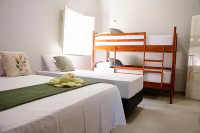 Uma cama ou camas num quarto em Casa Refúgio Tropical
