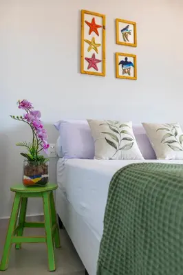 Uma cama ou camas num quarto em Casa Refúgio Tropical