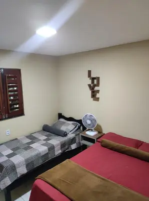 Uma cama ou camas num quarto em Chalé aconchego do Áureo 2