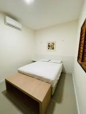 Uma cama ou camas num quarto em Linda Casa de Praia Família com até 10 pessoas