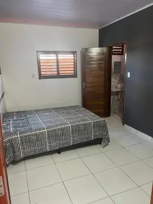 Uma cama ou camas num quarto em Casa por do Sol