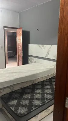 Uma cama ou camas num quarto em Casa por do Sol