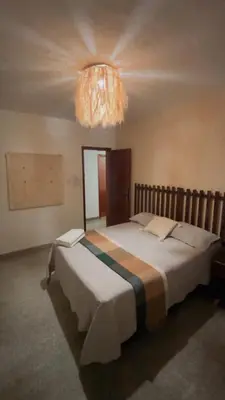 Uma cama ou camas num quarto em Casa do Kite