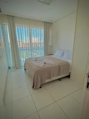Uma cama ou camas num quarto em Palm Beach Cobertura Duplex ao lado do Beach Park