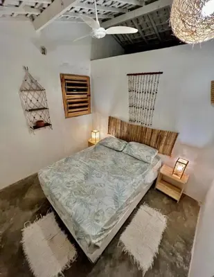 Uma cama ou camas num quarto em Casa Sereia Icapuí