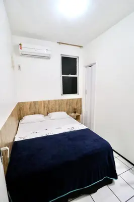 Uma cama ou camas num quarto em Apartamento Mobiliado AptCE
