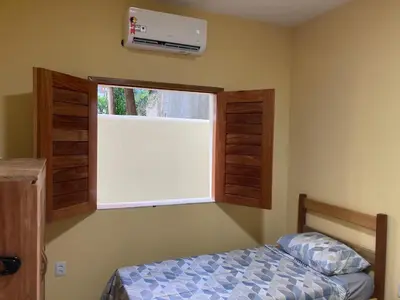 Uma cama ou camas num quarto em Paraíso na praia