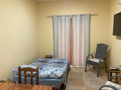 Uma cama ou camas num quarto em Paraíso na praia