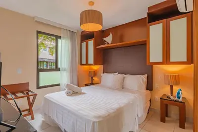 Uma cama ou camas num quarto em VG Sun #109 - Apartamento em Cumbuco by Carpediem