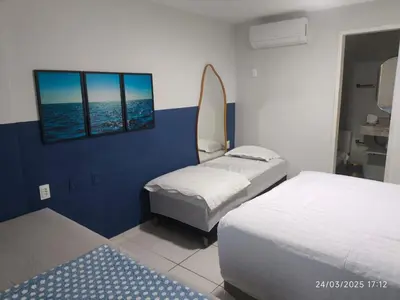 Uma cama ou camas num quarto em Ap2Quartos P Futuro Cartier Vista Mar 14