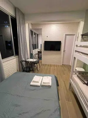 Uma cama ou camas num quarto em Estudio em plena Beira Mar