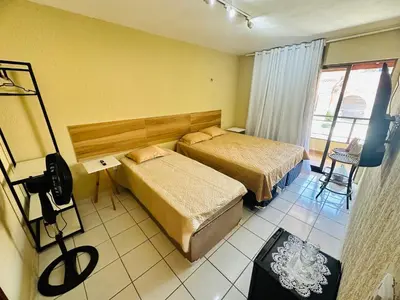 Uma cama ou camas num quarto em Suites Holanda